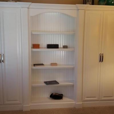 Custom bookshelf with hidden closet
