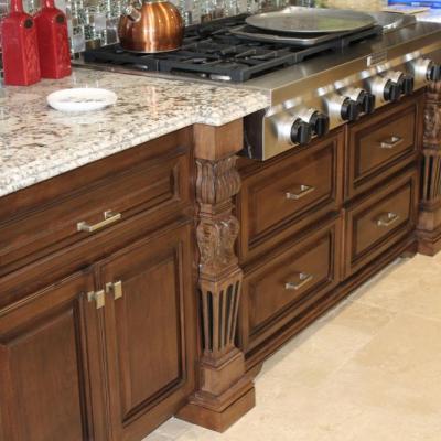 Custom kitchen cabinets with custom flutes in a dark stain. 